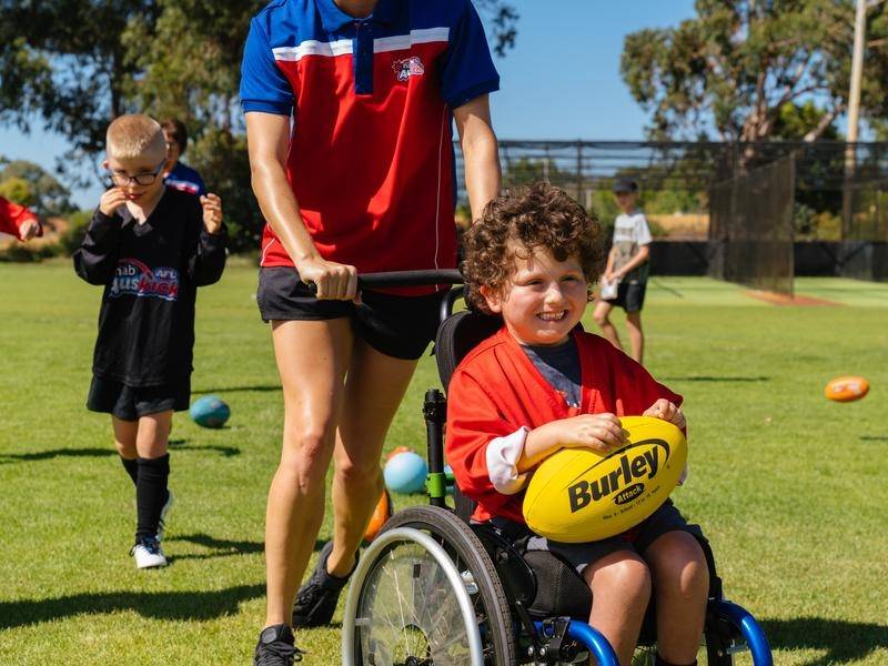 Disability inclusion program levels footy playing field