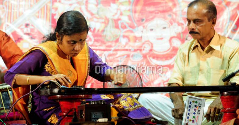 A blind girl playing an musical instrument